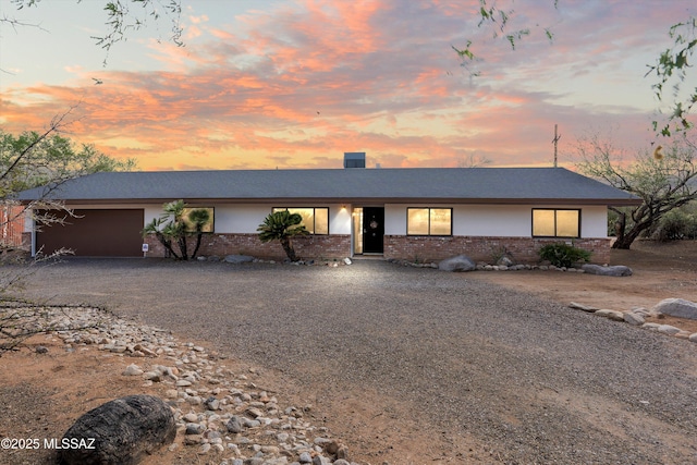 1241 W Cananea Cir, Tucson, AZ 85704 - view of front of house with brick siding, driveway, and an attached garage