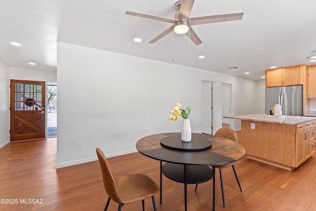 1241 W Cananea Cir, Tucson, AZ 85704 - dining room featuring baseboards, recessed lighting, light wood-style flooring, and a ceiling fan
