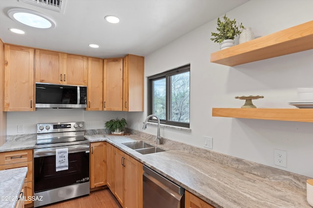 1241 W Cananea Cir, Tucson, AZ 85704 - kitchen featuring stainless steel appliances, open shelves, a sink, light stone countertops, and light brown cabinets
