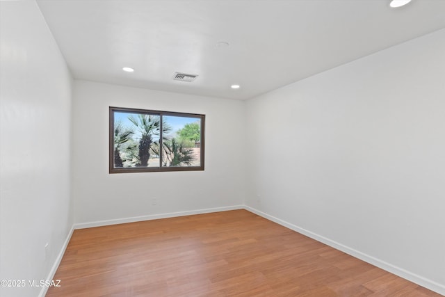 1241 W Cananea Cir, Tucson, AZ 85704 - unfurnished room with light wood finished floors, recessed lighting, and baseboards