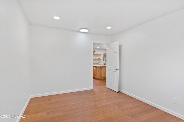 1241 W Cananea Cir, Tucson, AZ 85704 - unfurnished room with light wood finished floors, baseboards, and recessed lighting