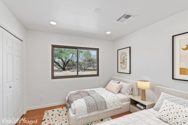 1241 W Cananea Cir, Tucson, AZ 85704 - bedroom featuring wood finished floors, baseboards, recessed lighting, and a closet