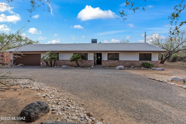 1241 W Cananea Cir, Tucson, AZ 85704 - single story home with dirt driveway, brick siding, and a garage