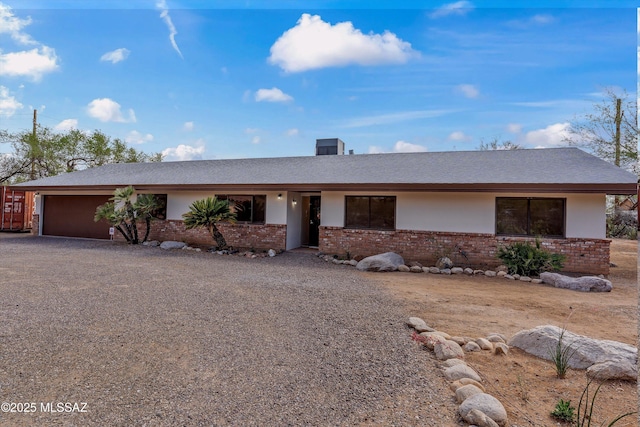 1241 W Cananea Cir, Tucson, AZ 85704 - ranch-style house with brick siding, driveway, an attached garage, and a shingled roof