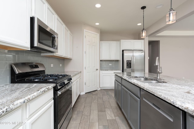 8040 N Desert Gum Dr, Tucson, AZ 85741 - kitchen featuring appliances with stainless steel finishes, a sink, recessed lighting, and white cabinets
