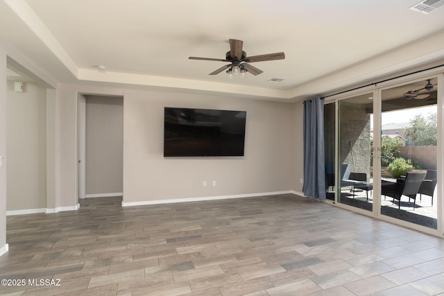 8040 N Desert Gum Dr, Tucson, AZ 85741 - unfurnished room with a raised ceiling, ceiling fan, and baseboards