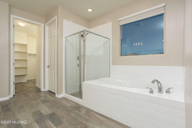 8040 N Desert Gum Dr, Tucson, AZ 85741 - bathroom featuring a shower stall, a bath, a spacious closet, wood finished floors, and recessed lighting