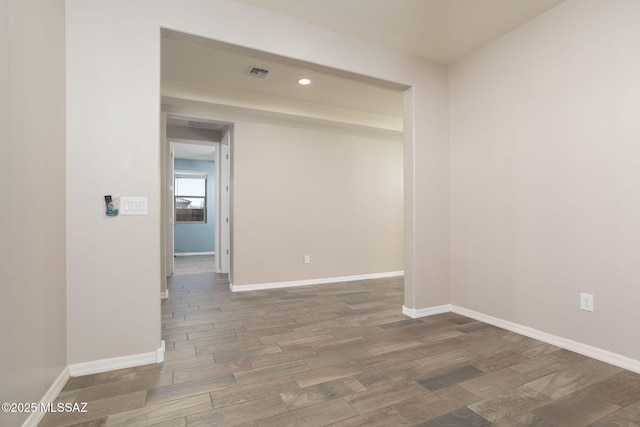 8040 N Desert Gum Dr, Tucson, AZ 85741 - empty room featuring wood finished floors, recessed lighting, and baseboards