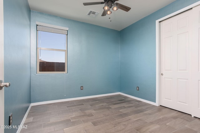 8040 N Desert Gum Dr, Tucson, AZ 85741 - unfurnished room featuring a ceiling fan, wood finished floors, and baseboards