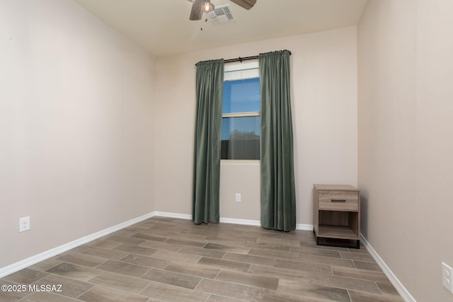 8040 N Desert Gum Dr, Tucson, AZ 85741 - spare room with ceiling fan, wood finish floors, and baseboards