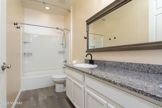 8040 N Desert Gum Dr, Tucson, AZ 85741 - full bath featuring toilet, vanity, shower / washtub combination, and wood finished floors