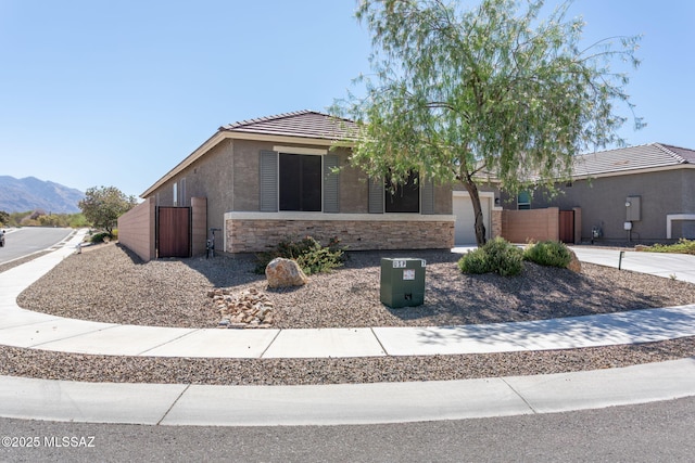 8040 N Desert Gum Dr, Tucson, AZ 85741 - ranch-style house with stucco siding, stone siding, an attached garage, a tiled roof, and concrete driveway