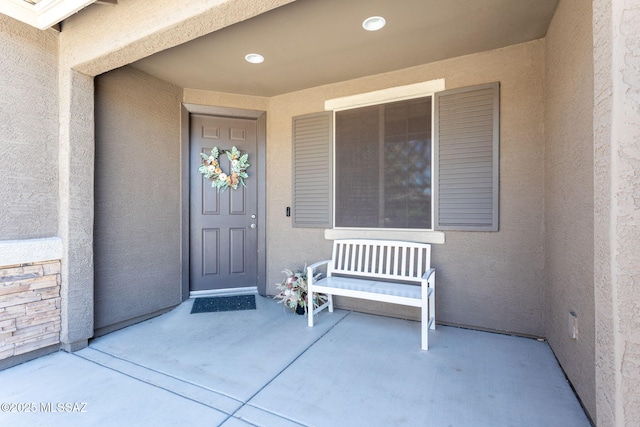 8040 N Desert Gum Dr, Tucson, AZ 85741 - view of exterior entry featuring stucco siding and covered porch
