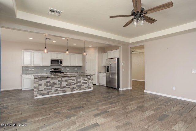 8040 N Desert Gum Dr, Tucson, AZ 85741 - kitchen with appliances with stainless steel finishes, ceiling fan, tasteful backsplash, white cabinetry, and a sink