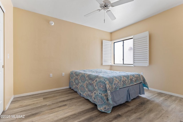 140 E Paseo De Golf, Green Valley, AZ 85614 - bedroom featuring wood finished floors, baseboards, and a ceiling fan