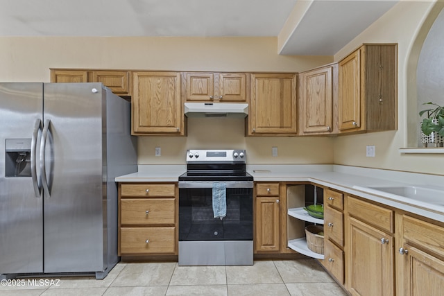 140 E Paseo De Golf, Green Valley, AZ 85614 - kitchen featuring appliances with stainless steel finishes, under cabinet range hood, light countertops, and light tile patterned floors