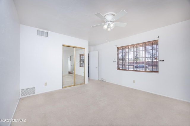 5449 E Rosewood St, Tucson, AZ 85711 - carpeted empty room with a ceiling fan and baseboards