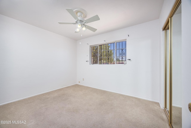 5449 E Rosewood St, Tucson, AZ 85711 - unfurnished bedroom with a closet, carpet flooring, baseboards, and ceiling fan