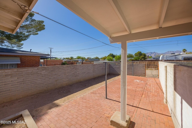 5449 E Rosewood St, Tucson, AZ 85711 - fenced backyard featuring a patio and a mountain view