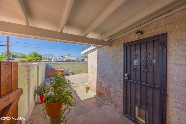 5449 E Rosewood St, Tucson, AZ 85711 - view of exterior entry with brick siding