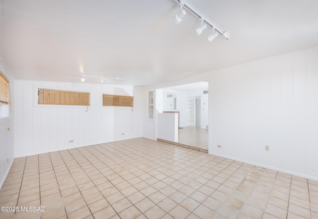5449 E Rosewood St, Tucson, AZ 85711 - empty room featuring rail lighting