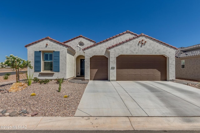 1936 N Star Vw Ln, Green Valley, AZ 85614 - mediterranean / spanish-style home with a garage, stucco siding, driveway, and a tiled roof