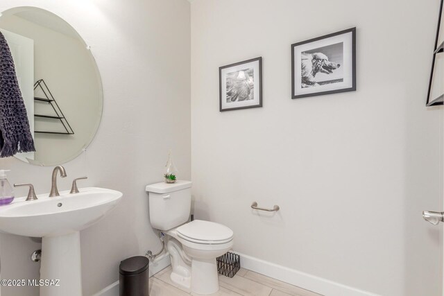 1936 N Star Vw Ln, Green Valley, AZ 85614 - bathroom featuring baseboards, toilet, tile patterned floors, and a sink
