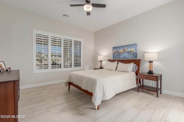 1936 N Star Vw Ln, Green Valley, AZ 85614 - bedroom with baseboards, light wood-style flooring, and ceiling fan