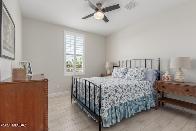 1936 N Star Vw Ln, Green Valley, AZ 85614 - bedroom with baseboards, light wood-type flooring, and ceiling fan