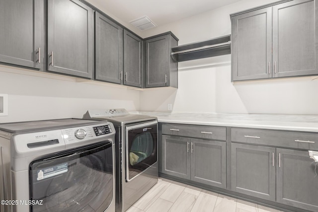 1936 N Star Vw Ln, Green Valley, AZ 85614 - laundry area with cabinet space and separate washer and dryer