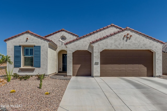 1936 N Star Vw Ln, Green Valley, AZ 85614 - mediterranean / spanish house featuring a garage, driveway, stucco siding, and a tiled roof