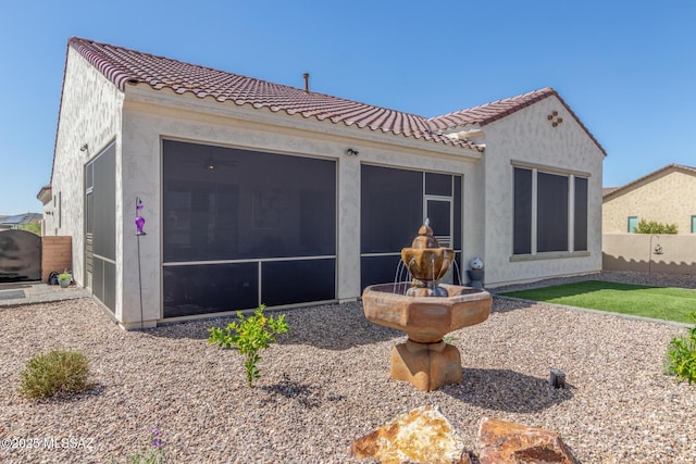 1936 N Star Vw Ln, Green Valley, AZ 85614 - back of property featuring a sunroom, a tile roof, fence, and stucco siding