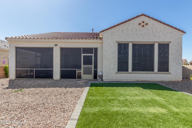 1936 N Star Vw Ln, Green Valley, AZ 85614 - rear view of house with a sunroom, stucco siding, a lawn, and a tile roof