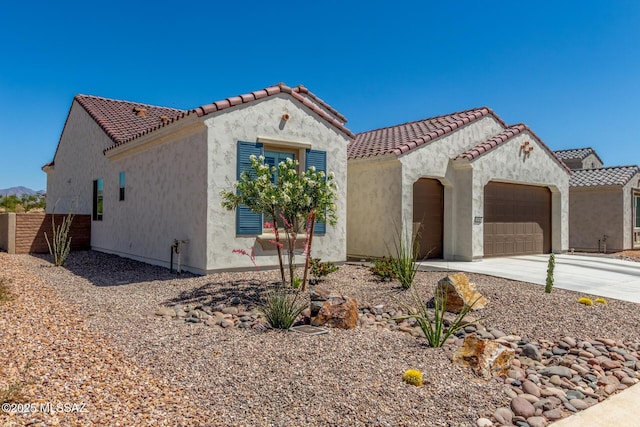 1936 N Star Vw Ln, Green Valley, AZ 85614 - mediterranean / spanish-style home featuring an attached garage, stucco siding, and concrete driveway