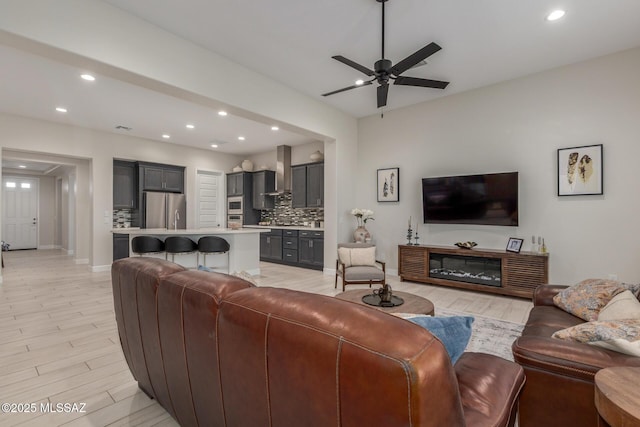 1936 N Star Vw Ln, Green Valley, AZ 85614 - living area with recessed lighting, ceiling fan, baseboards, and light wood-type flooring
