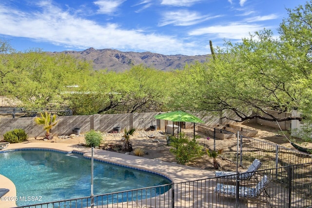 3600 N Hash Knife Cir, Tucson, AZ 85749 - view of swimming pool with a fenced backyard and a mountain view
