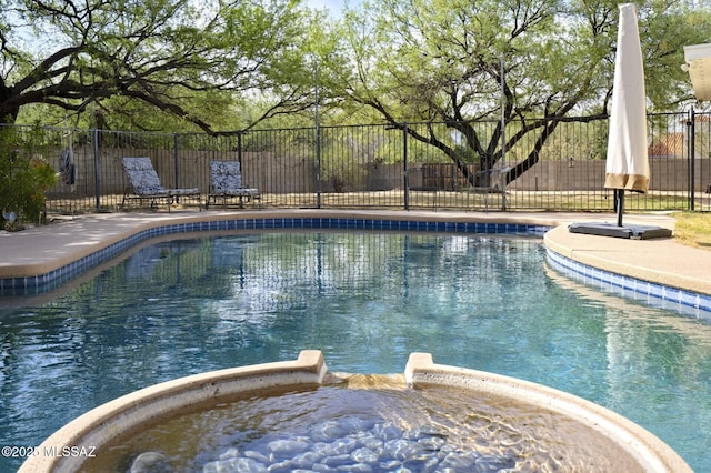 3600 N Hash Knife Cir, Tucson, AZ 85749 - view of swimming pool with fence and a pool with connected hot tub