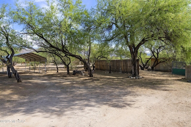 3600 N Hash Knife Cir, Tucson, AZ 85749 - view of yard with fence and a carport