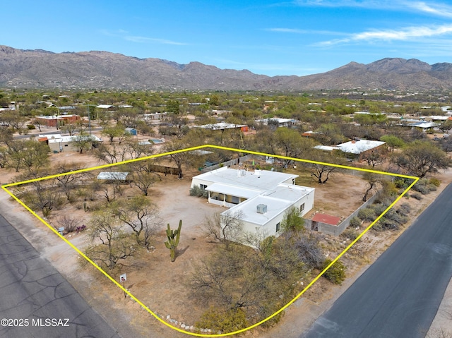 3600 N Hash Knife Cir, Tucson, AZ 85749 - aerial view of property and surrounding area featuring a mountain backdrop and property parcel outlined
