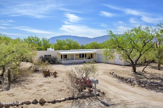 3600 N Hash Knife Cir, Tucson, AZ 85749 - back of house with a mountain view and a porch
