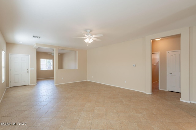 15815 S Via Cayetano, Sahuarita, AZ 85629 - empty room featuring a ceiling fan, baseboards, and light tile patterned floors