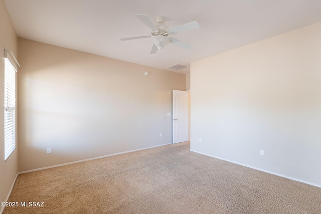 15815 S Via Cayetano, Sahuarita, AZ 85629 - empty room with plenty of natural light, a ceiling fan, baseboards, and light colored carpet