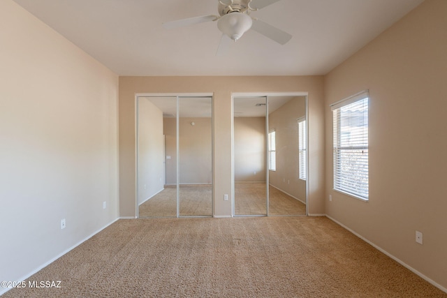 15815 S Via Cayetano, Sahuarita, AZ 85629 - unfurnished bedroom with two closets, carpet floors, baseboards, and ceiling fan