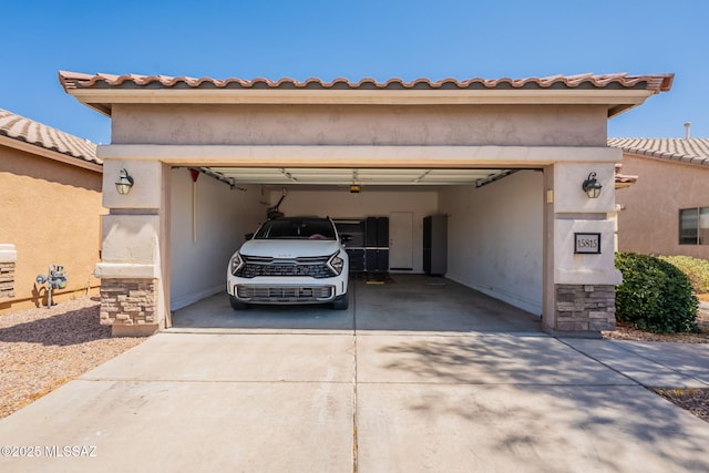 15815 S Via Cayetano, Sahuarita, AZ 85629 - view of front of property with driveway, stucco siding, an attached garage, and stone siding