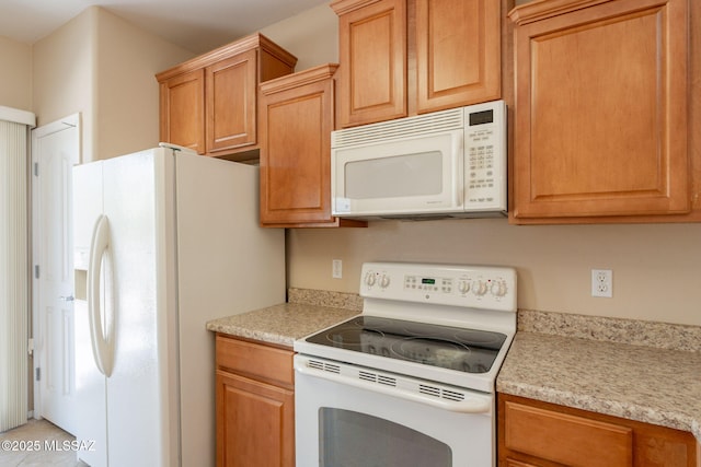 15815 S Via Cayetano, Sahuarita, AZ 85629 - kitchen with white appliances and light countertops