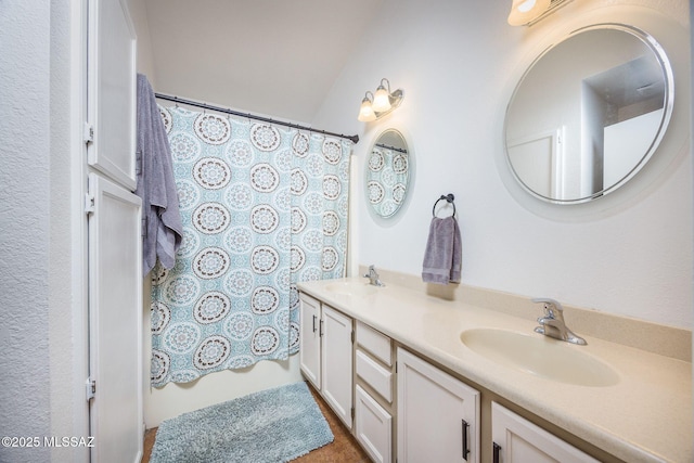 2804 W Camino Ebano, Tucson, AZ 85742 - bathroom with double vanity and a shower with shower curtain