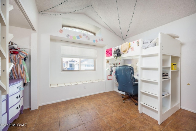 2804 W Camino Ebano, Tucson, AZ 85742 - tiled office with a textured ceiling, vaulted ceiling, and baseboards
