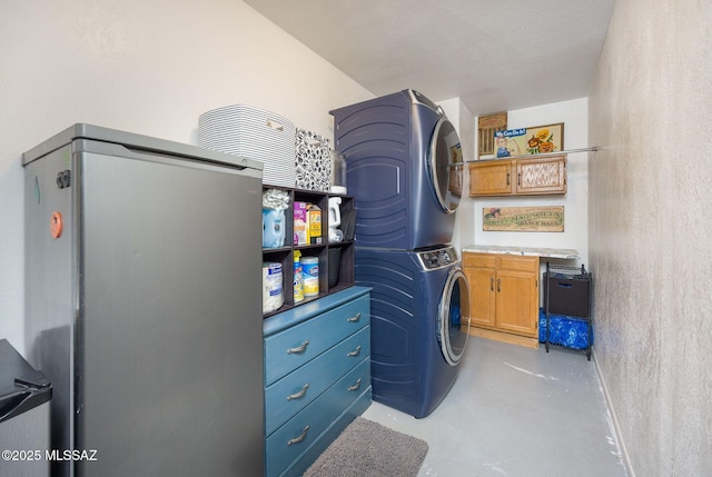 2804 W Camino Ebano, Tucson, AZ 85742 - laundry area with stacked washing machine and dryer and cabinet space