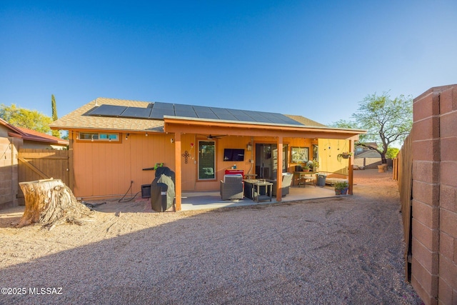 2804 W Camino Ebano, Tucson, AZ 85742 - back of house featuring a patio area, roof mounted solar panels, a ceiling fan, and a fenced backyard