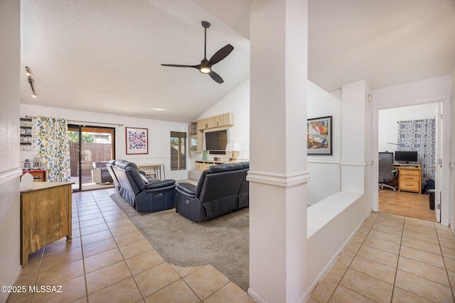 2804 W Camino Ebano, Tucson, AZ 85742 - living room featuring light tile patterned floors, ceiling fan, a desk, light colored carpet, and decorative columns